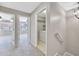 Hallway with access to bedrooms and laundry area at 5308 Rollinsford Ct, Tampa, FL 33624