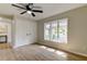 Bedroom with wood-look floors, large window, and double closets at 9308 Pebble Creek Dr, Tampa, FL 33647