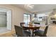 Modern dining room with a view of the kitchen and patio at 9308 Pebble Creek Dr, Tampa, FL 33647