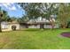 Charming single-story house with a well-maintained lawn at 9308 Pebble Creek Dr, Tampa, FL 33647