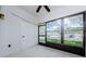 Enclosed Florida room with tiled floors and view of the street at 2650 Countryside Blvd # F110, Clearwater, FL 33761