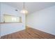 Dining area with laminate flooring and kitchen pass-through at 2650 Countryside Blvd # F110, Clearwater, FL 33761