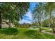 Community features a pond, lush landscaping, and well-maintained grounds at 2650 Countryside Blvd # F110, Clearwater, FL 33761