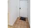 Condo entryway with tiled floor and a welcome mat at 2650 Countryside Blvd # F110, Clearwater, FL 33761