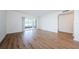 Living room with laminate wood floors and sliding glass doors at 2650 Countryside Blvd # F110, Clearwater, FL 33761