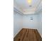 Walk-in closet with wire shelving and wood-look flooring at 2650 Countryside Blvd # F110, Clearwater, FL 33761