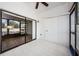 Bright Florida Room with sliding glass doors and view of the outdoors at 2650 Countryside Blvd # F110, Clearwater, FL 33761