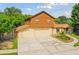 Two-story house with double garage and a pond in front at 10213 Newport Cir, Tampa, FL 33612