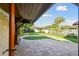 Backyard with a pool, patio, and lush greenery at 10213 Newport Cir, Tampa, FL 33612