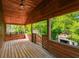 Wooden balcony with a swing and views of the backyard at 10213 Newport Cir, Tampa, FL 33612
