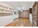 Spacious bedroom with wood flooring and ample built-in shelving at 10213 Newport Cir, Tampa, FL 33612