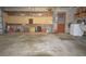 Garage interior with workbench, storage, and laundry appliances at 10213 Newport Cir, Tampa, FL 33612