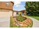 A charming house with stone accents, blue door and a pond at 10213 Newport Cir, Tampa, FL 33612