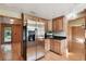 Kitchen with stainless steel refrigerator and wood cabinets at 10213 Newport Cir, Tampa, FL 33612