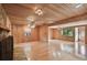 Large living room with hardwood floors and wood walls and ceilings at 10213 Newport Cir, Tampa, FL 33612