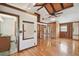 Bright bedroom with wood floors and ensuite bathroom access at 10213 Newport Cir, Tampa, FL 33612