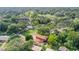Aerial view showcasing a tranquil, tree-lined neighborhood with homes and green spaces at 10213 Newport Cir, Tampa, FL 33612