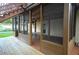 Screened porch with wooden deck and patio furniture, overlooking the backyard at 10213 Newport Cir, Tampa, FL 33612