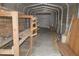 Interior of a metal storage building with lumber and storage racks at 10213 Newport Cir, Tampa, FL 33612