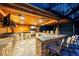 High-end outdoor kitchen featuring a large island and grill at 655 Appaloosa Rd, Tarpon Springs, FL 34688