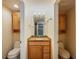 Jack and Jill bathroom with double toilets and granite vanity at 655 Appaloosa Rd, Tarpon Springs, FL 34688