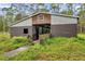 Spacious barn with multiple stalls and a metal roof at 655 Appaloosa Rd, Tarpon Springs, FL 34688