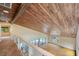 Open loft overlooking living area and pool at 655 Appaloosa Rd, Tarpon Springs, FL 34688