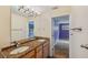 Double vanity bathroom with granite countertops and large mirrors at 655 Appaloosa Rd, Tarpon Springs, FL 34688