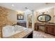 Elegant bathroom with a large jacuzzi tub and double vanity at 655 Appaloosa Rd, Tarpon Springs, FL 34688