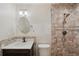 Updated bathroom with tile shower and vanity at 655 Appaloosa Rd, Tarpon Springs, FL 34688