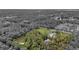 Aerial view of property showcasing a pond and expansive land at 655 Appaloosa Rd, Tarpon Springs, FL 34688