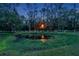 Peaceful pond with white fence and beautiful trees at 655 Appaloosa Rd, Tarpon Springs, FL 34688