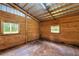 Empty horse stall with wood walls and metal flooring at 655 Appaloosa Rd, Tarpon Springs, FL 34688