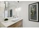 Modern powder room with floating vanity and statement art at 777 N Ashley Dr # 806, Tampa, FL 33602
