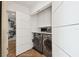 Convenient laundry room with washer, dryer, and extra storage at 777 N Ashley Dr # 806, Tampa, FL 33602