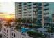 Luxury rooftop pool and lounge area with city views at sunset at 777 N Ashley Dr # 806, Tampa, FL 33602