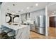 Modern kitchen with gray cabinetry and large island at 777 N Ashley Dr # 806, Tampa, FL 33602