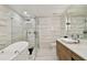 Spa-like bathroom with soaking tub, glass shower, and modern vanity at 777 N Ashley Dr # 806, Tampa, FL 33602