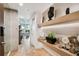 Bright and airy entryway with herringbone floors and built-in shelves at 777 N Ashley Dr # 806, Tampa, FL 33602