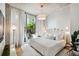 Bright bedroom with a plush bed and access to private balcony at 777 N Ashley Dr # 806, Tampa, FL 33602