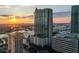 Aerial view of a modern highrise building at sunset, showcasing city views at 777 N Ashley Dr # 806, Tampa, FL 33602