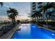Luxury rooftop pool at night with city views at 777 N Ashley Dr # 806, Tampa, FL 33602