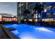 Evening view of resort-style pool with city skyline in background at 777 N Ashley Dr # 806, Tampa, FL 33602
