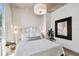 Spacious bedroom with white bedding and large mirror at 777 N Ashley Dr # 806, Tampa, FL 33602