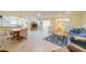 Spacious living room with tile floors, seating and dining area at 2535 Lancaster Dr # 2535, Sun City Center, FL 33573