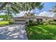 Single-story home with attached garage and landscaped yard at 2535 Lancaster Dr # 2535, Sun City Center, FL 33573