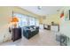 Bright sunroom with built-in workspace and seating area at 2535 Lancaster Dr # 2535, Sun City Center, FL 33573