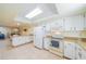 Efficient kitchen with white cabinets and modern appliances at 2535 Lancaster Dr # 2535, Sun City Center, FL 33573