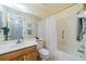 Clean bathroom with shower/tub combo and wood vanity at 2535 Lancaster Dr # 2535, Sun City Center, FL 33573