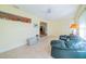 Sunroom features a comfortable couch and plenty of natural light at 2535 Lancaster Dr # 2535, Sun City Center, FL 33573